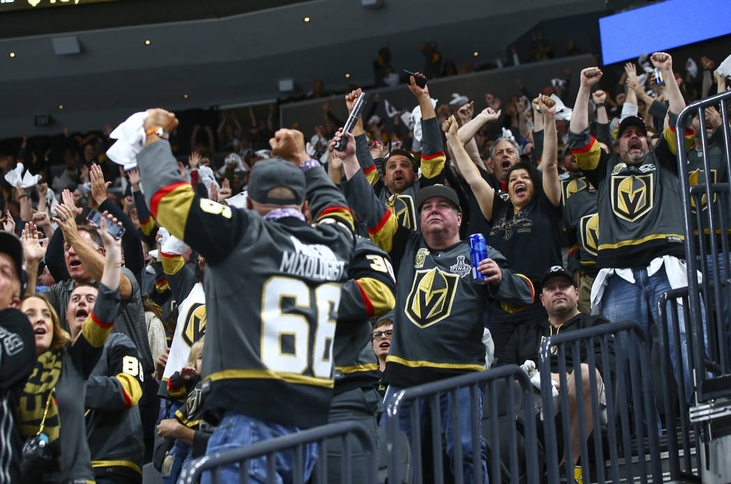 Golden Knights fans celebrate a goal by Golden Knights center Jonathan Marchessault, not pictur ...