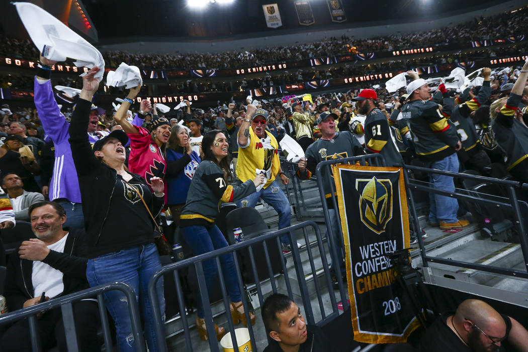 Golden Knights fans celebrate a goal by Golden Knights center Jonathan Marchessault, not pictur ...