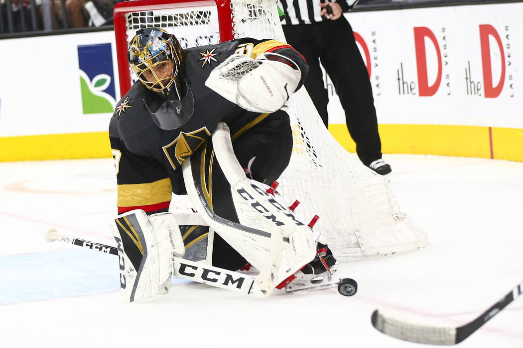 Golden Knights goaltender Marc-Andre Fleury (29) blocks a shot from the San Jose Sharks during ...