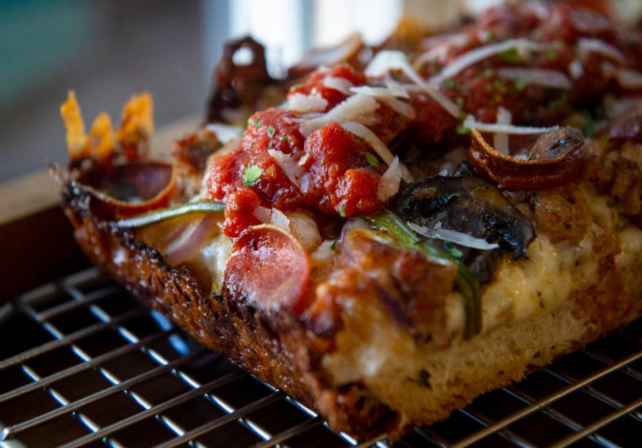 A slice of gluten-free Detroit supreme pizza, also known as the Diana Ross, sits out at Good Pi ...