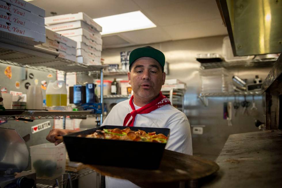 Vincent Rotolo takes out a gluten-free pie at Good Pie at Pawn Plaza in Las Vegas, Thursday, Ap ...