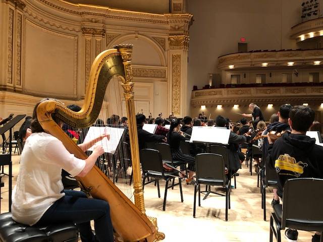 Students in the Clark High School orchestra practicing before their performance in Carnegie Hal ...