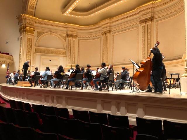 Chuck Cushinery, orchestra director at Clark High School directing the orchestra during a rehea ...