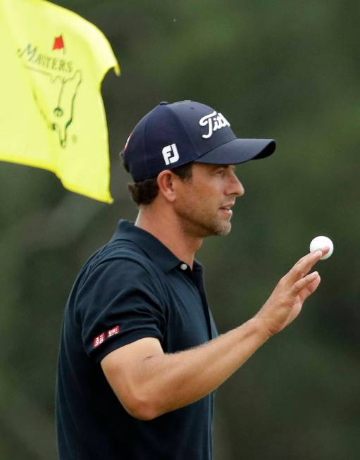 Adam Scott, of Australia, waves on the 18th holeduring the final round for the Masters golf tou ...