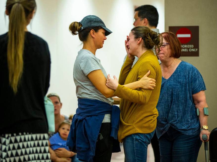 Family members and supporters comfort each other after former Metro officer Pamela Bordeaux, ch ...