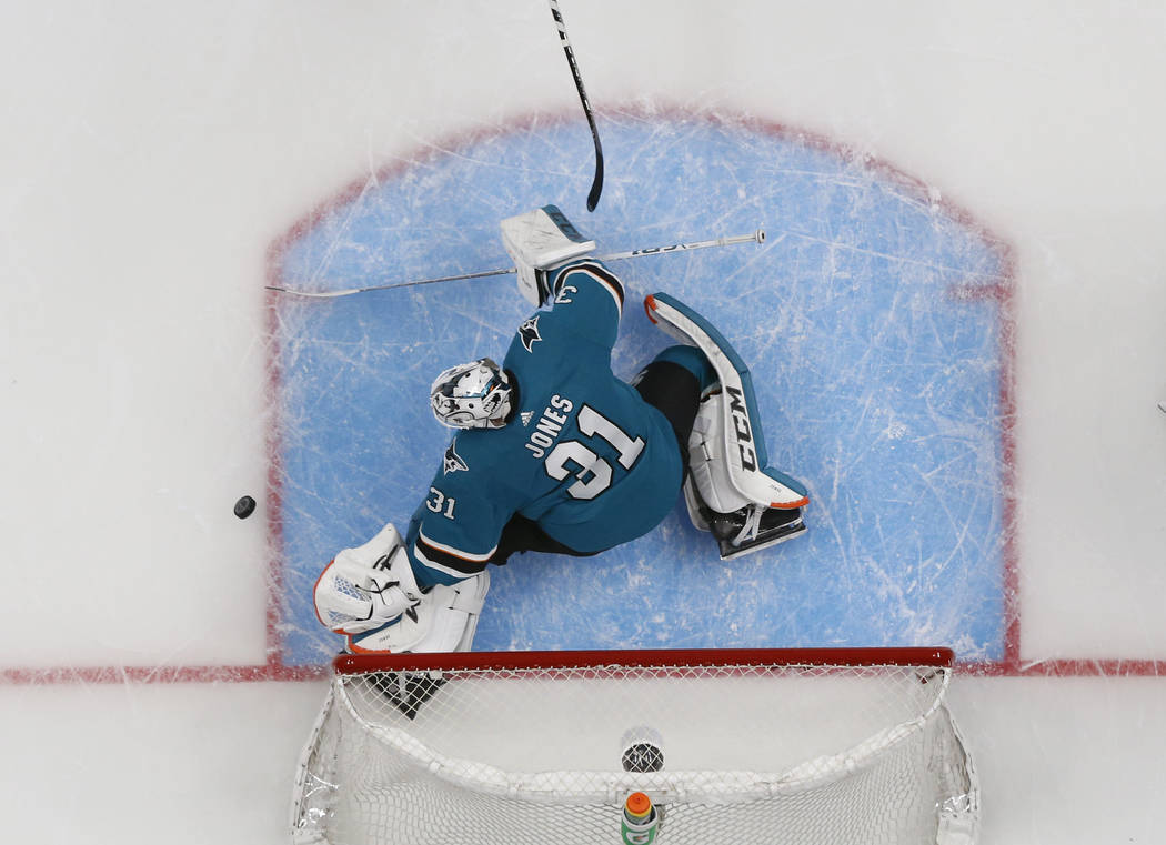 San Jose Sharks goaltender Martin Jones (31) makes a save against the Colorado Avalanche in the ...