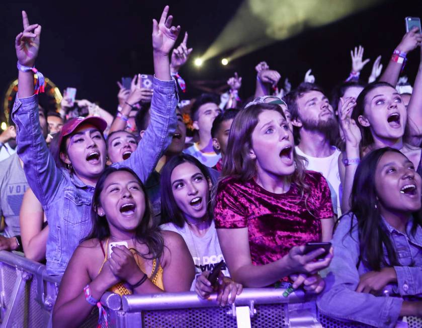 Fans react as Chance the Rapper performs on the first day of the Life is Beautiful festival in ...