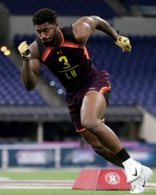 Kentucky linebacker Josh Allen runs a drill at the NFL football scouting combine in Indianapoli ...