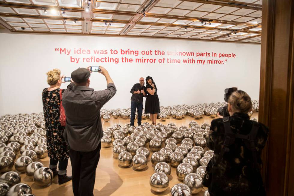 Attendees walk through "Aftermath of Obliteration of Eternity and Narcissus Garden" a ...