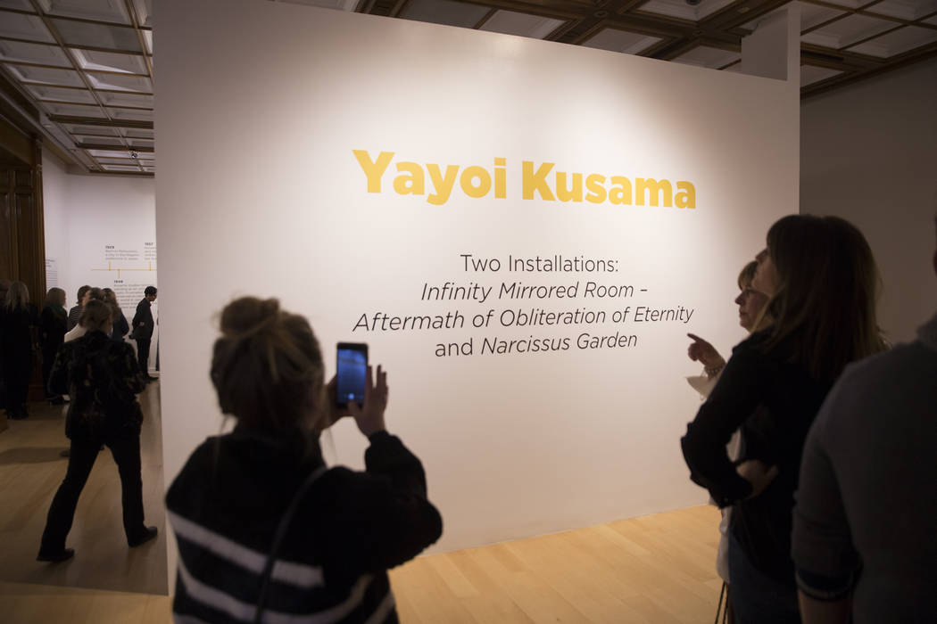 Attendees explore Yayoi Kusama's new exhibit at Bellagio Gallery of Fine Art on Friday, Nov. 16 ...