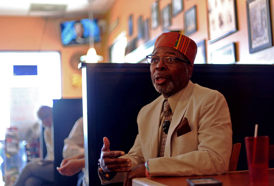 Rodney Smith asks a question of democratic presidential candidate Andrew Yang at a town hall ho ...