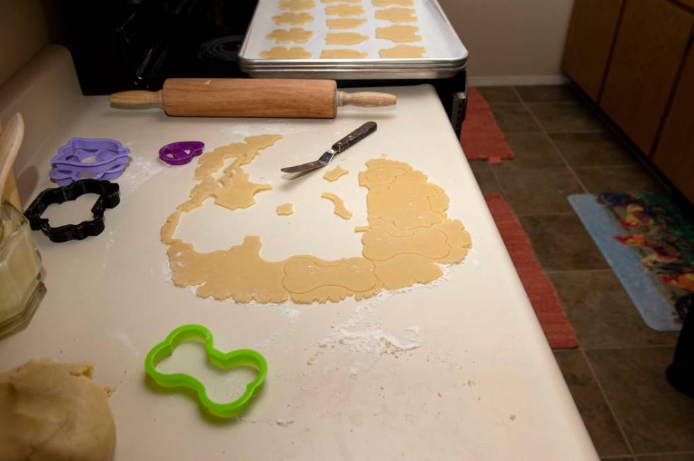 Leftover cookie dough sits out as Owner of Cakes, Cookies and Creations Jessica Dejarnett bakes ...