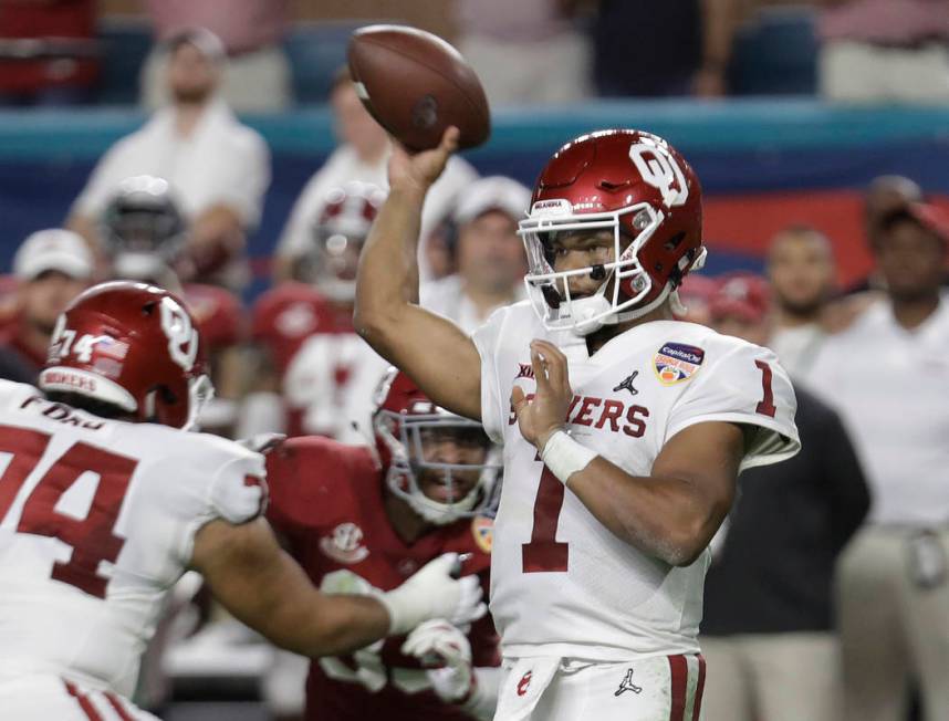 Oklahoma quarterback Kyler Murray (1) looks to pass, during the first half of the Orange Bowl N ...