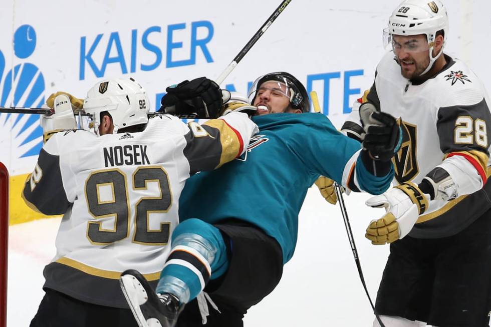 Knights left wing Tomas Nosek (92) punches Sharks defenseman Brenden Dillon (4) in the second p ...