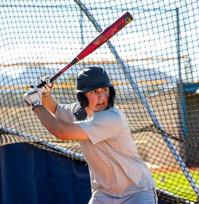 The Meadows School third baseman Sam Kaplan eyes a pitch during hitting practice, he will play ...