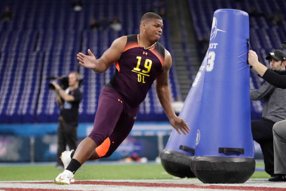 Alabama defensive lineman Quinnen Williams runs a drill at the NFL football scouting combine in ...