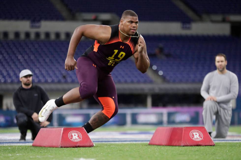 Alabama defensive lineman Quinnen Williams runs a drill at the NFL football scouting combine in ...