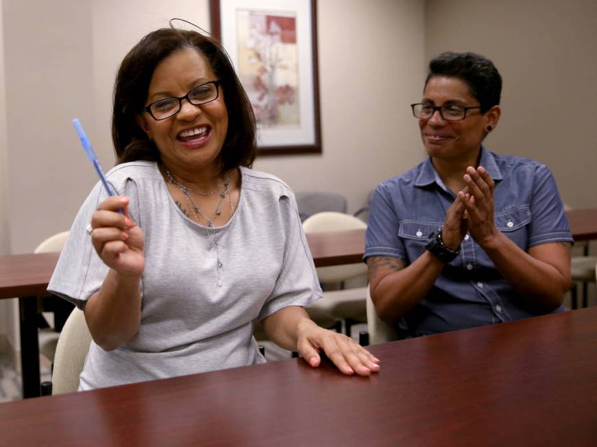 Ana Martinez, a veteran who was homeless two years ago, celebrates with her partner Lydia Luna ...