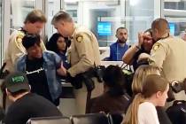 Rosetta Swinney is arrested by Las Vegas police at McCarran International Airport on Saturday, ...
