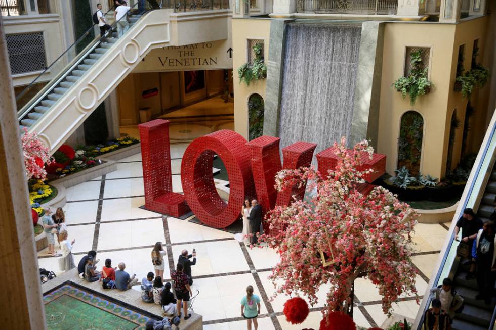 Guests mingle in the Waterfall Atrium at The Venetian on the Strip in Las Vegas Thursday, April ...