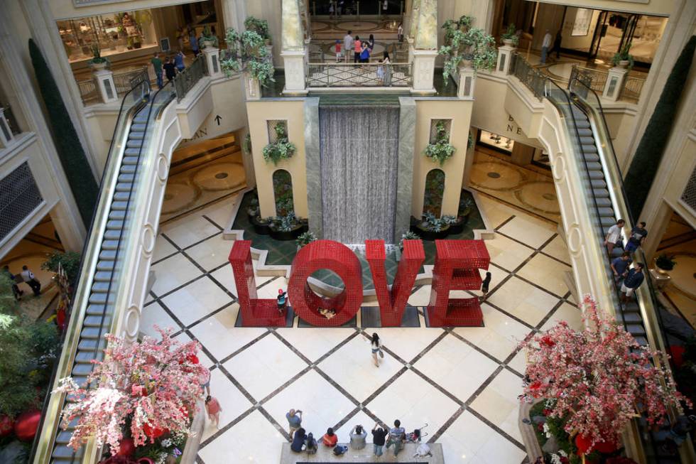 Guests mingle in the Waterfall Atrium at The Venetian on the Strip in Las Vegas Thursday, April ...