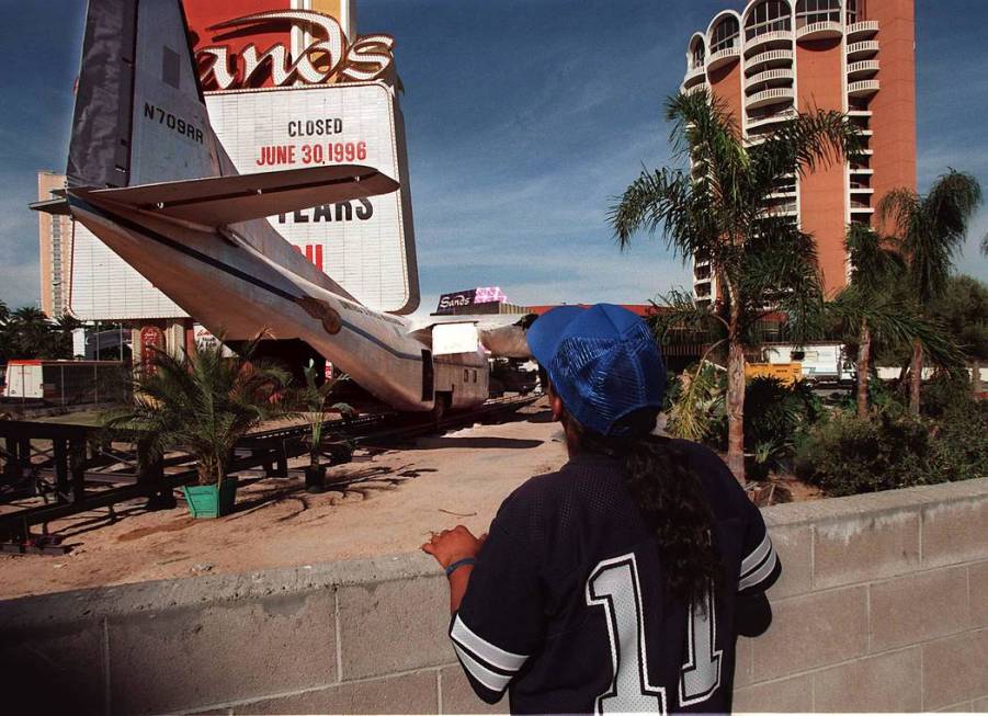 Andrew Moran of Las Vegas, checks out the airplane movie prop set up front of the Sands hotel-c ...