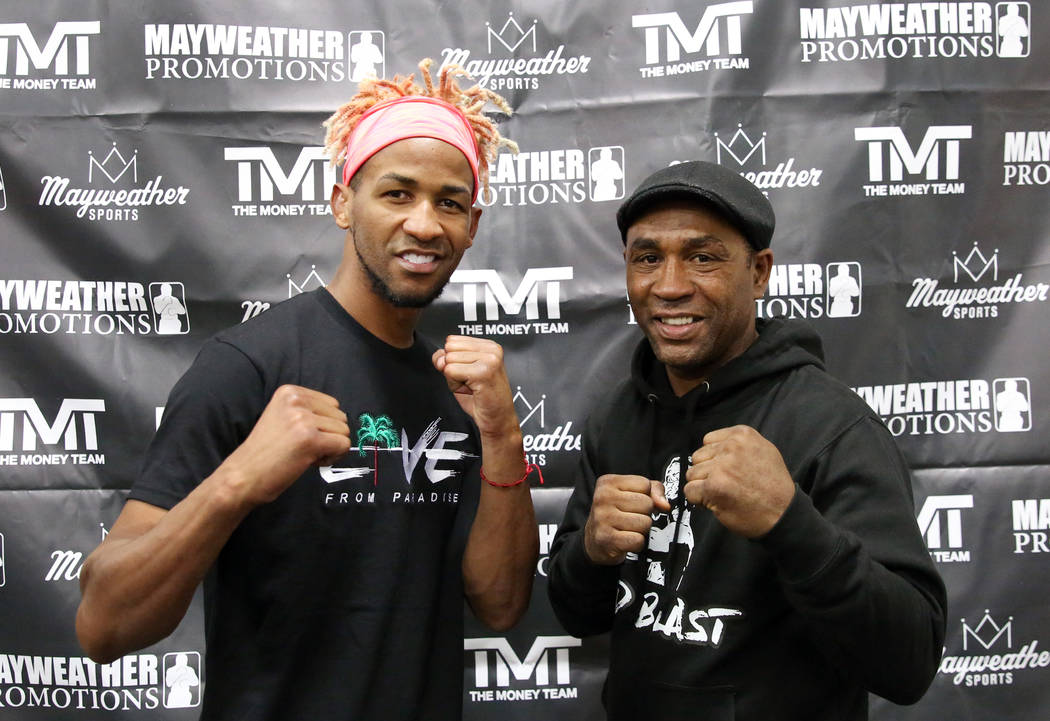 Former two-division world champion Rances Barthelemy left, poses for a photo with his trainer J ...