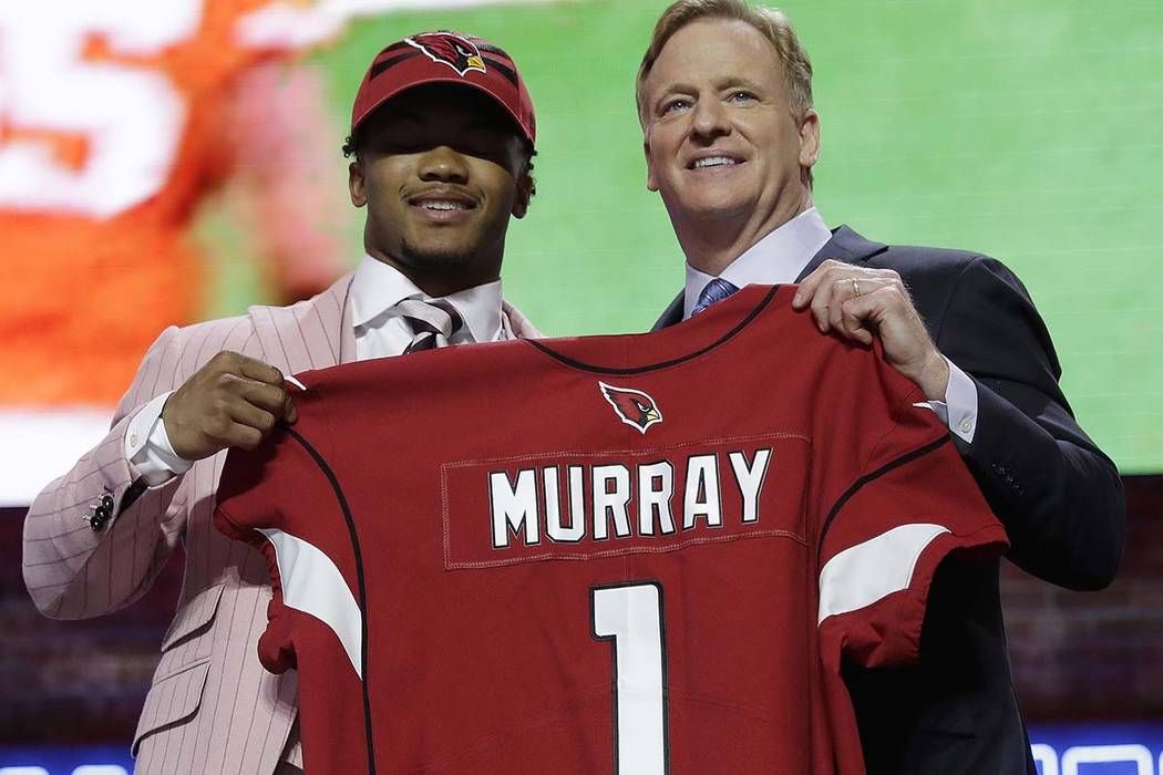 Oklahoma quarterback Kyler Murray poses with NFL Commissioner Roger Goodell after the Arizona C ...