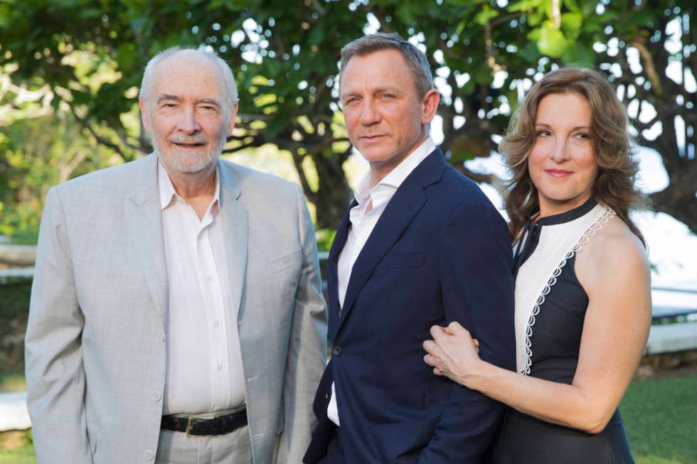 Producers Michael G Wilson, left, and Barbara Broccoli, right, pose for photographers with acto ...