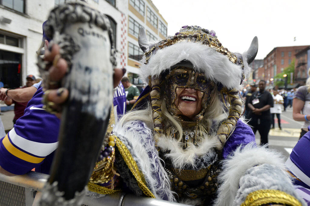 A Minnesota Vikings fan poses for a photo during the 2019 NFL Draft Thursday, Apr. 25, 2019, in ...