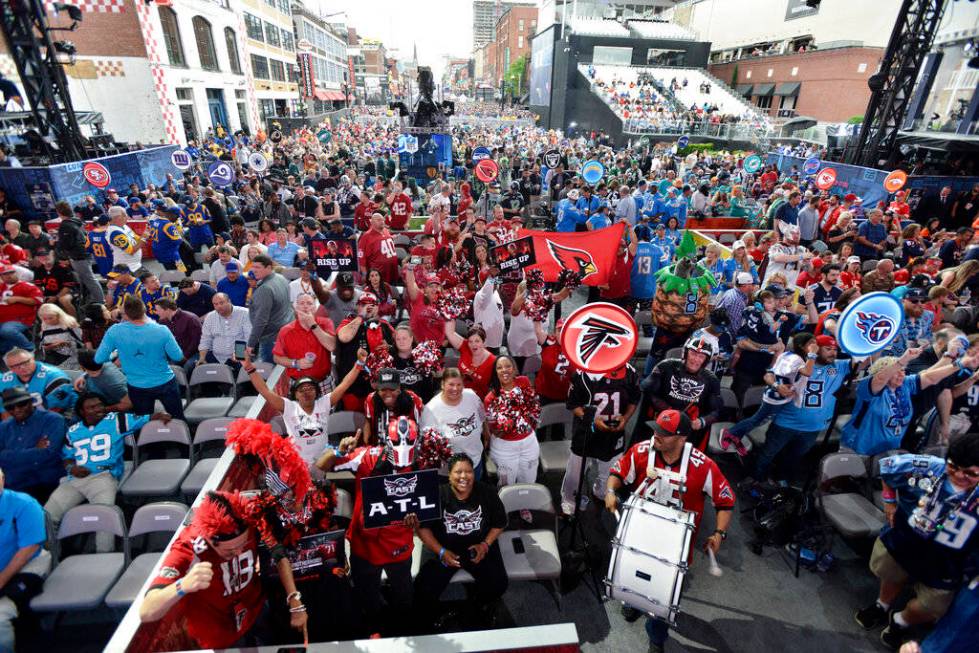 Fans gather in front of the stage during the 2019 NFL Draft Thursday, Apr. 25, 2019, in Nashvil ...