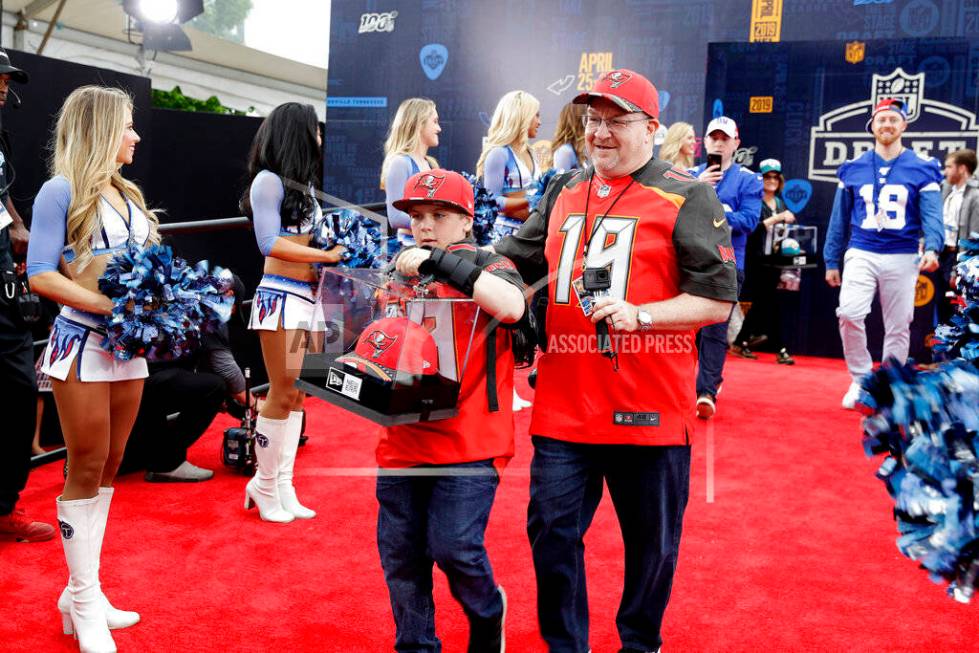 Fans walks the red carpet ahead of the first round at the NFL football draft, Thursday, April 2 ...