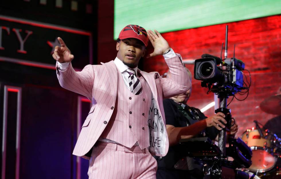 Oklahoma quarterback Kyler Murray enters the main stage after the Arizona Cardinals selected Mu ...