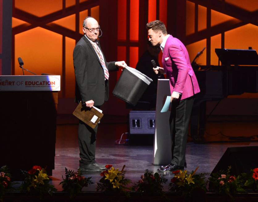 Emcee Erich Bergen spits out a lozenge on stage during the Heart of Education Awards for Clark ...