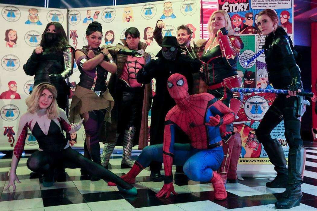 Critical Care Comics cosplayers pose for a photo before the first showing of Avengers: Endgame ...