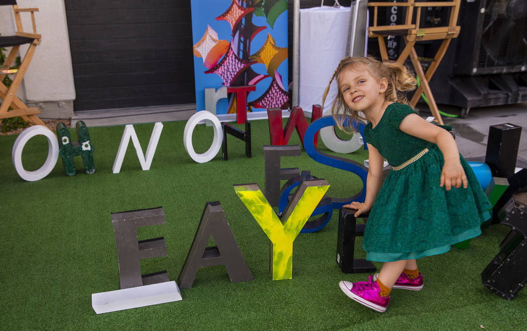 Faye Kerlin Stoelting, 3, is pleased to spell out her name during the Believer Festival, a thre ...
