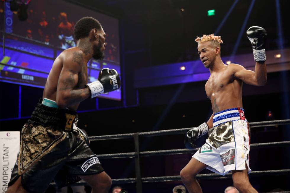 Robert Easter Jr., left, battles Rances Barthelemy in the WBA lightweight championship bout at ...