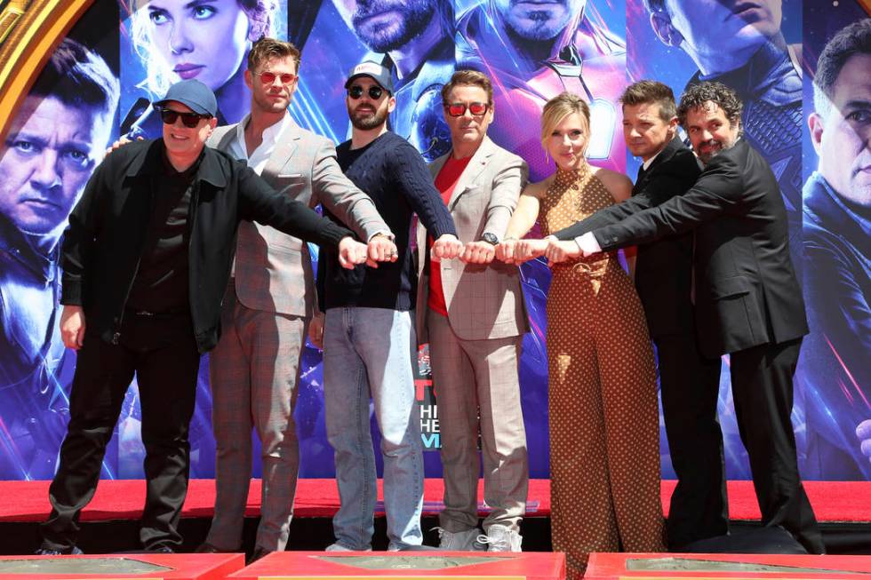 Marvel Studios President Kevin Feige, from left, poses with members of the cast of "Avenge ...