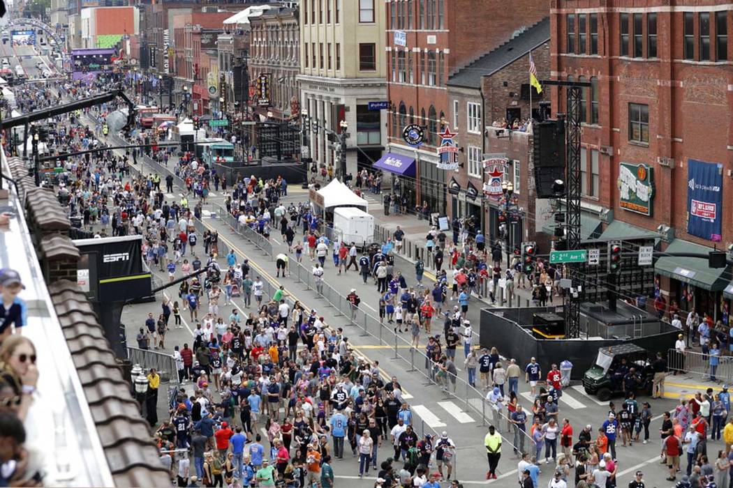 Fans attend the final day of the NFL football draft Saturday, April 27, 2019, in Nashville, Ten ...