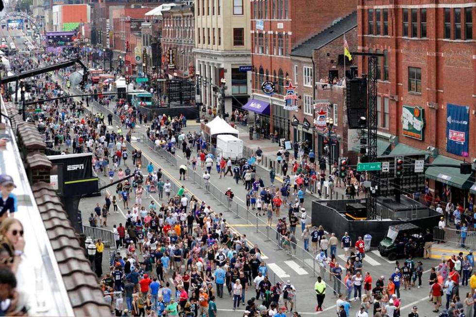 Fans attend the final day of the NFL football draft Saturday, April 27, 2019, in Nashville, Ten ...