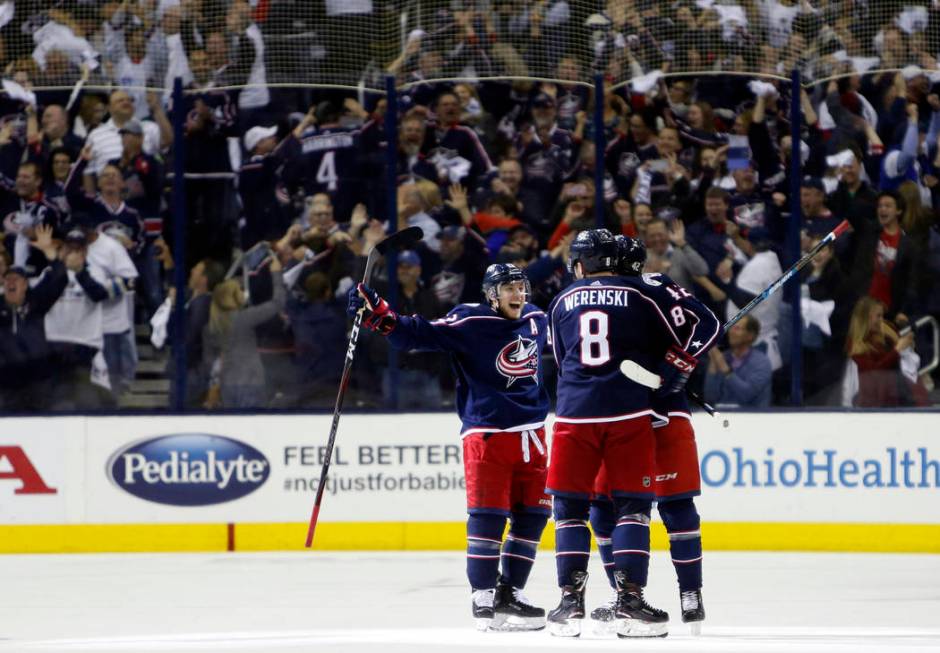 Columbus Blue Jackets players celebrate their goal against the Tampa Bay Lightning during the t ...