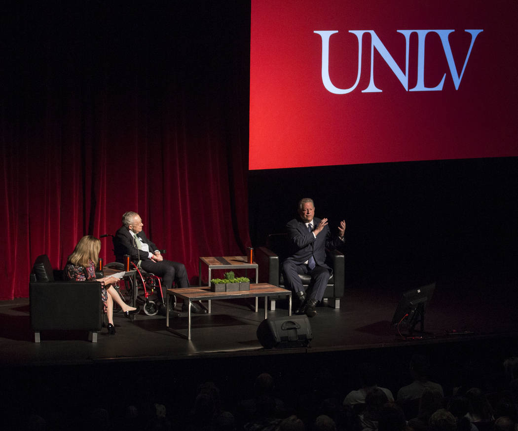 Former U.S. Vice President Al Gore, top/right, discusses climate change with former Sen. Harry ...