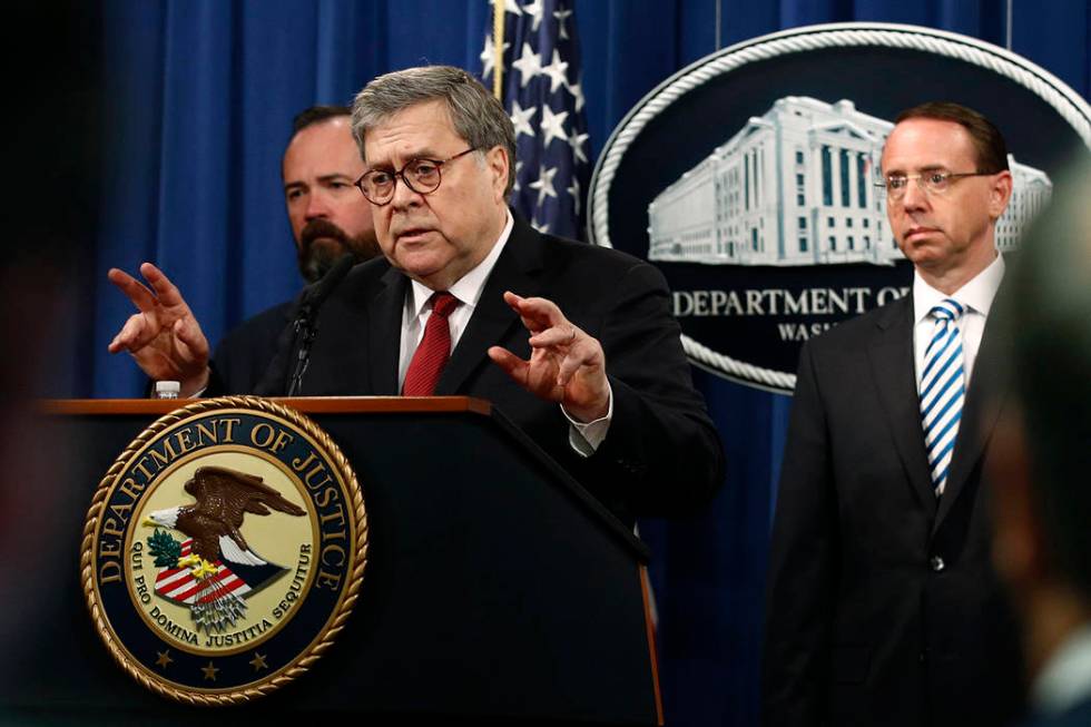 Attorney General William Barr speaks alongside Deputy Attorney General Rod Rosenstein, right, a ...