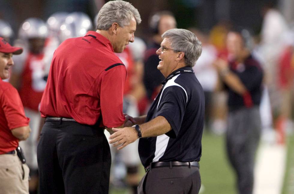 UNLV supporter Dean McQuillan, left, talks with UNLV interim athletic director Jerry Koloskie o ...