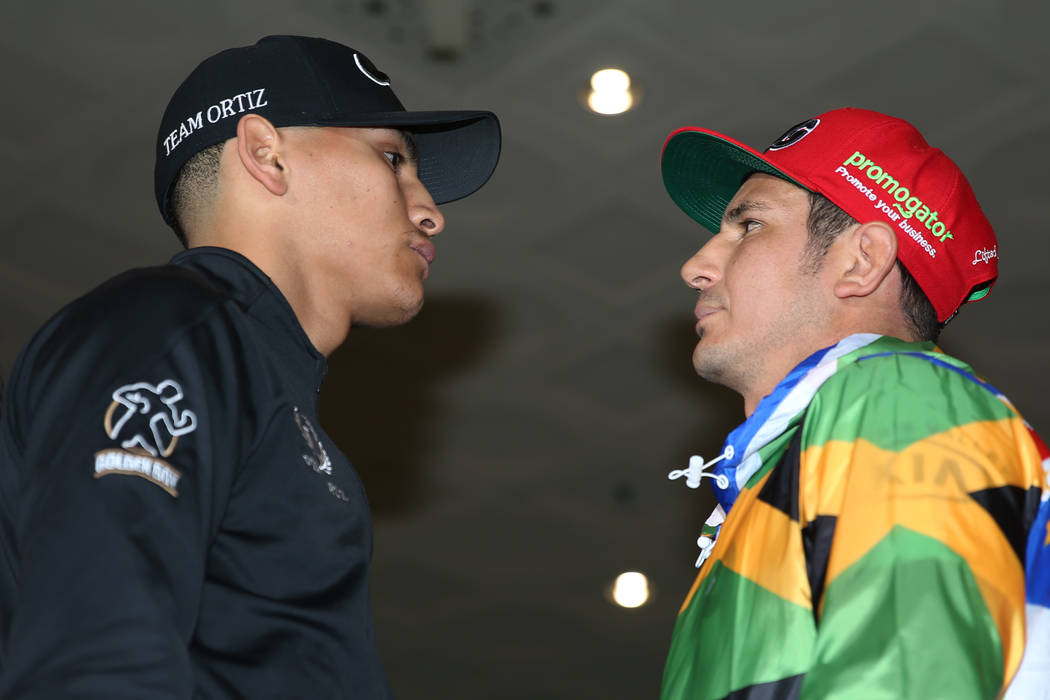 Vergil Ortiz Jr., left, and Mauricio Herrera pose during their grand arrival at MGM Grand hotel ...