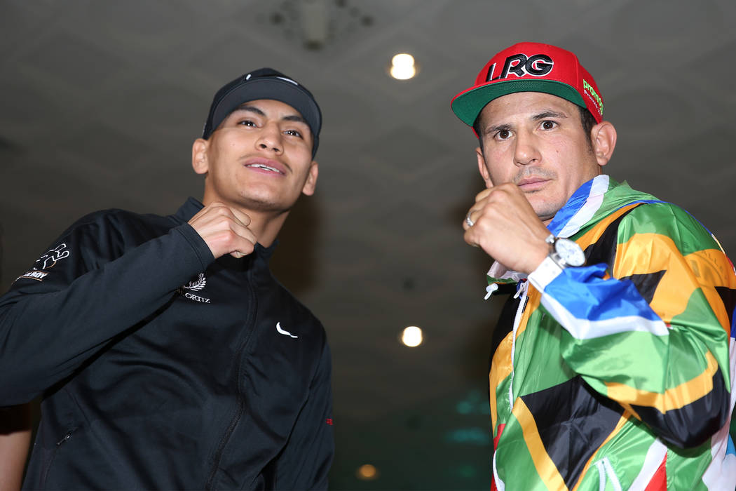 Vergil Ortiz Jr., left, and Mauricio Herrera pose during their grand arrival at MGM Grand hotel ...