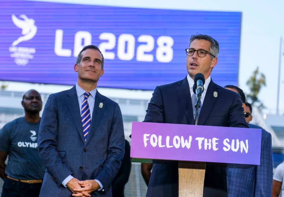 FILE - In this July 31, 2017, file photo, Los Angeles Mayor Eric Garcetti, left, listens as Los ...