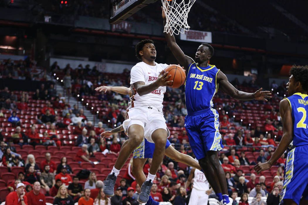 UNLV Rebels forward Tervell Beck (14) goes up for a shot under pressure from San Jose State Spa ...