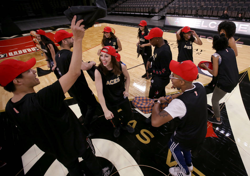 Members of the WNBA Las Vegas Aces Wild Card Crew, celebrate after finding out they made the te ...