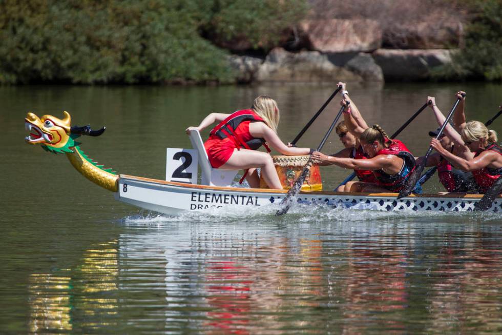 Members of the Skittles dragon boat race team participate in a race during the Nevada Internati ...